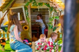 A toddler, babies and their mums enjoying fairytale forest