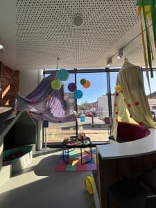 Hullabaloo café with colour decorations hanging up