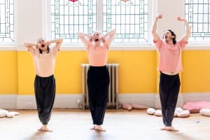 3 actors standing up looking sleepy