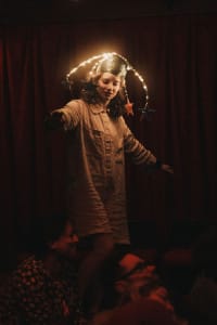 An actress with lit up headwear on