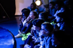 Amazed children watching the show