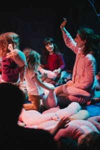 Children look at an actress in awe