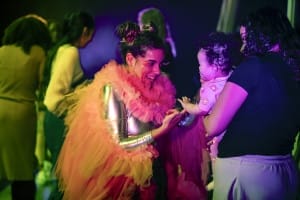 Take Flight actress conversing with a baby on set